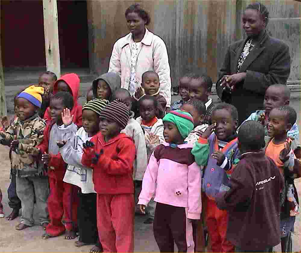 School kids line up to sing a song for us.