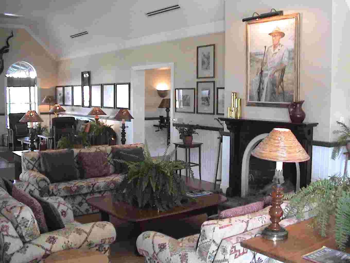 The lounge area and a painting of Harry Kirkman, who was the first director of Kruger National Park.