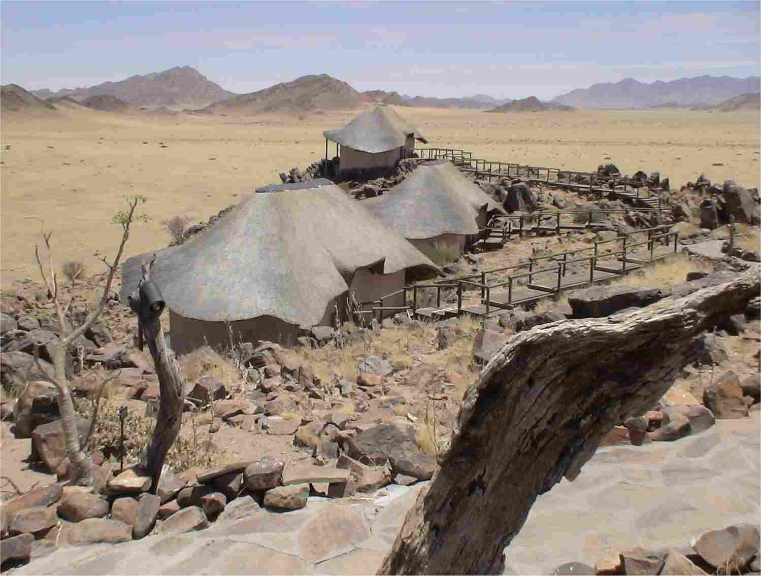 Three of the nine chalets at Sossusvlei Wilderness Camp. Ours is in the foreground. Photo by FG.