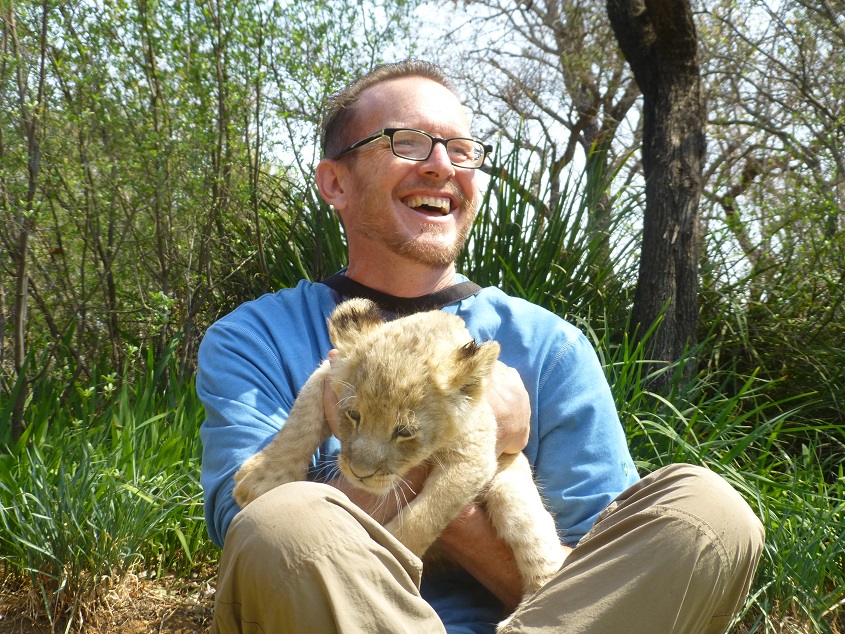 Bob petting lion cubs. Photo by FG.