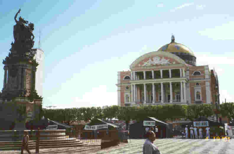 Photo of the famed Manaus Opera House (referred to as the 'Amazon Theater' in our tourist booklet), taken from St. Sebastian's Square, with the Albertura dos Portos monument at left.  Photo by JCG.