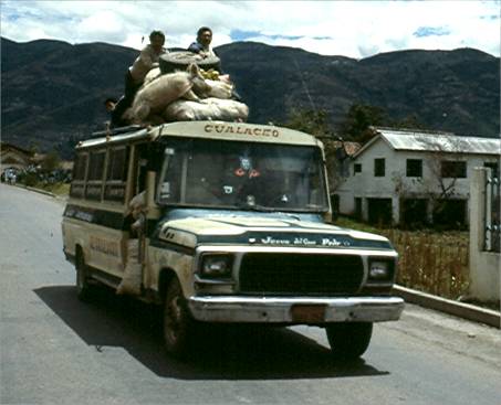 Look closely and you can see a pig lashed to the roof of the bus.  Photo by Dad.