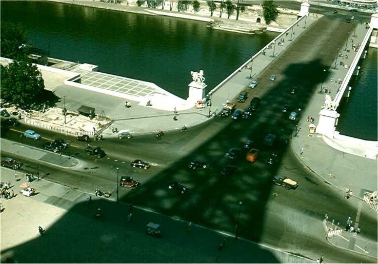 The Eifle Tower's shadow edges across the Seine. Photo by FG.
