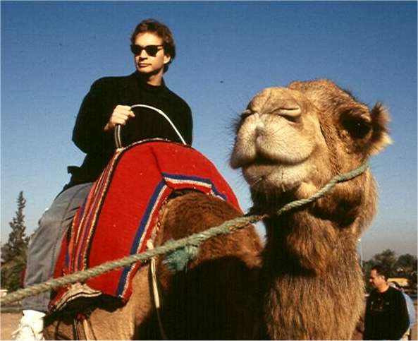 My younger son, Tim, takes a camel ride.  Photo by FG.