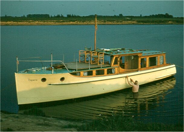 Cornelius cleans his boat. He named it 'Espero,' meaning 'the hope of man.' He believed a common world language, Esperonto, would unify all the world's people. Photo by FG.